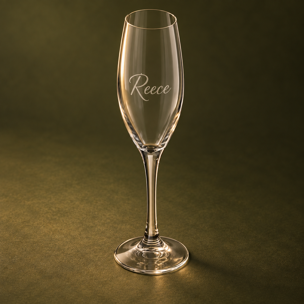 Side angle of engraved 170 ml champagne flute on olive background
