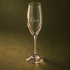 Side angle of engraved 170 ml champagne flute on olive background