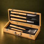 Open bamboo gift box showing five stainless steel braai tools
