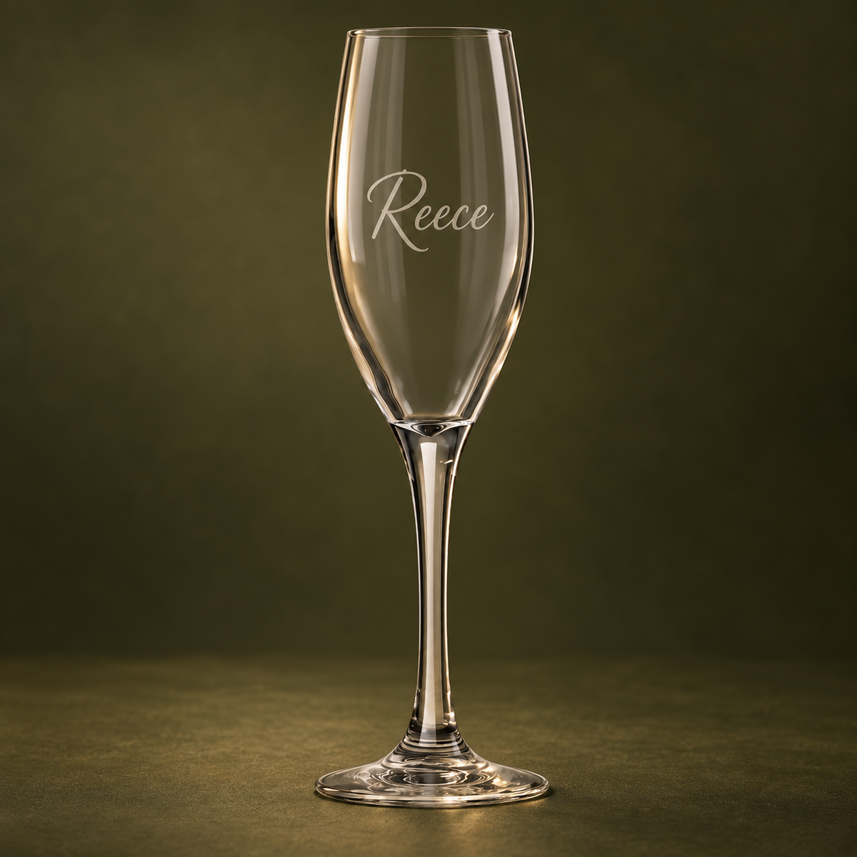 170 ml personalised Libbey Perception champagne glass engraved with Reece on dark olive background