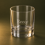 Side angle of engraved 245 ml whiskey tumbler on olive background
